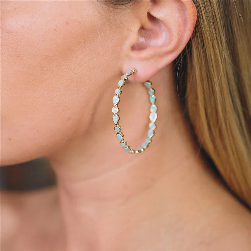 Élégance lumineuse - Boucles d'oreilles en opale bleue et or