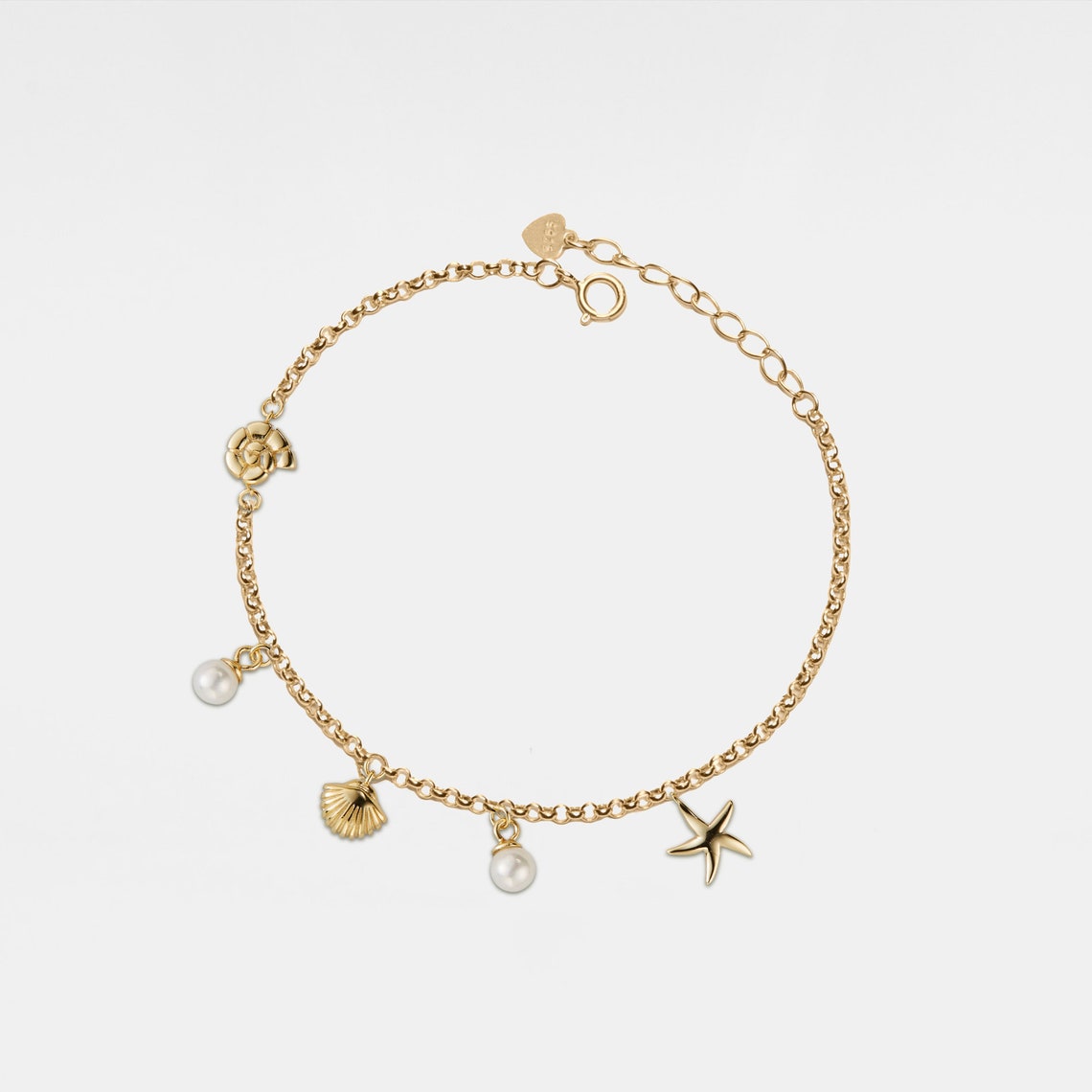 Bracelet avec charme de coquillage et étoile de mer