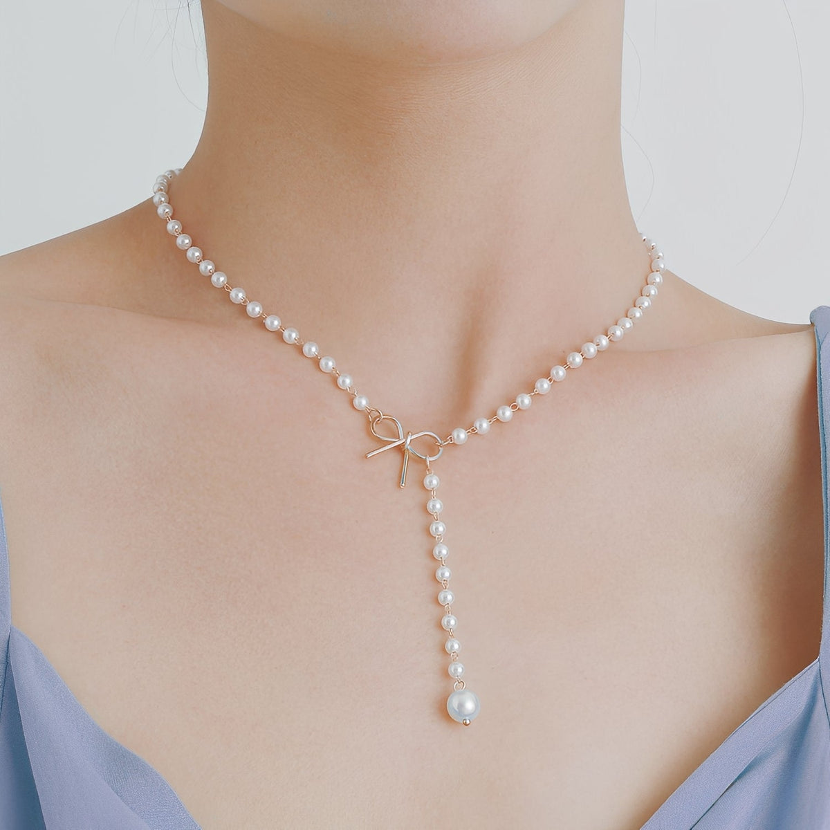 Antoneth – Collier avec pendentif nœud avec perle