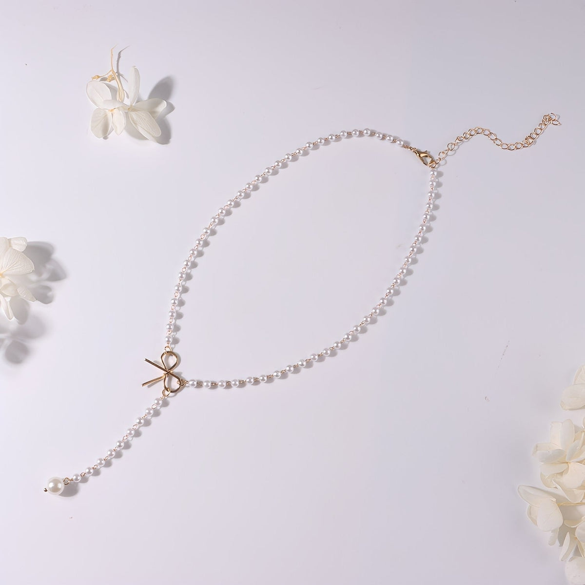 Antoneth – Collier avec pendentif nœud avec perle